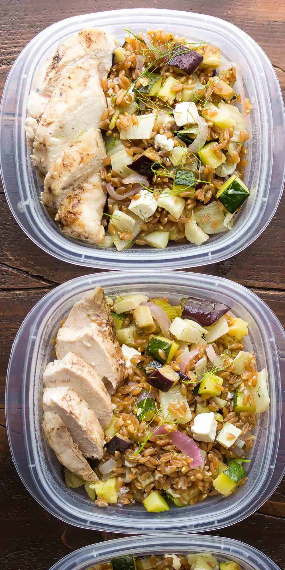 two meal prep containers with the mediterranean farro chicken lunch bowls