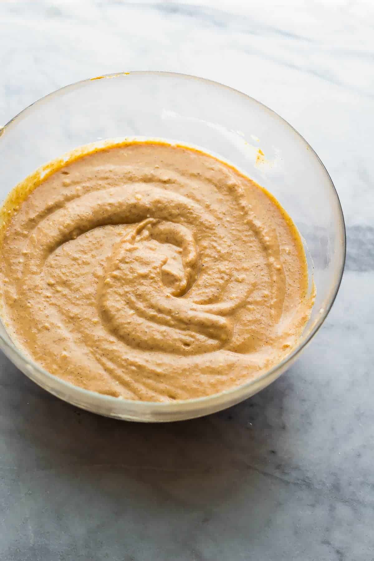 pumpkin greek yogurt cheesecake batter in bowl