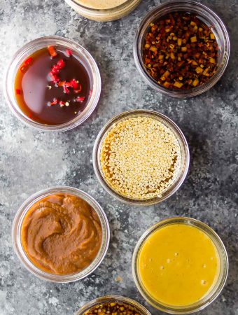 overhead shot of 7 easy stir fry sauces on gray background