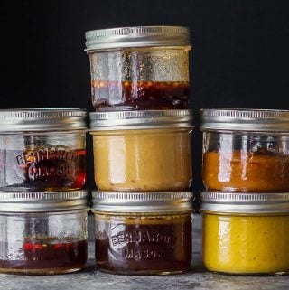 stacks of glass jars with 7 easy stir fry sauce recipes in them