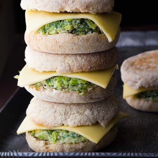 stack of three healthy breakfast sandwiches with one in background