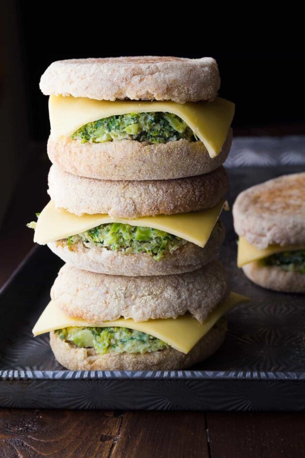 stack of three healthy breakfast sandwiches with one in background