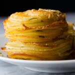 herb and garlic potato stacks on white plate