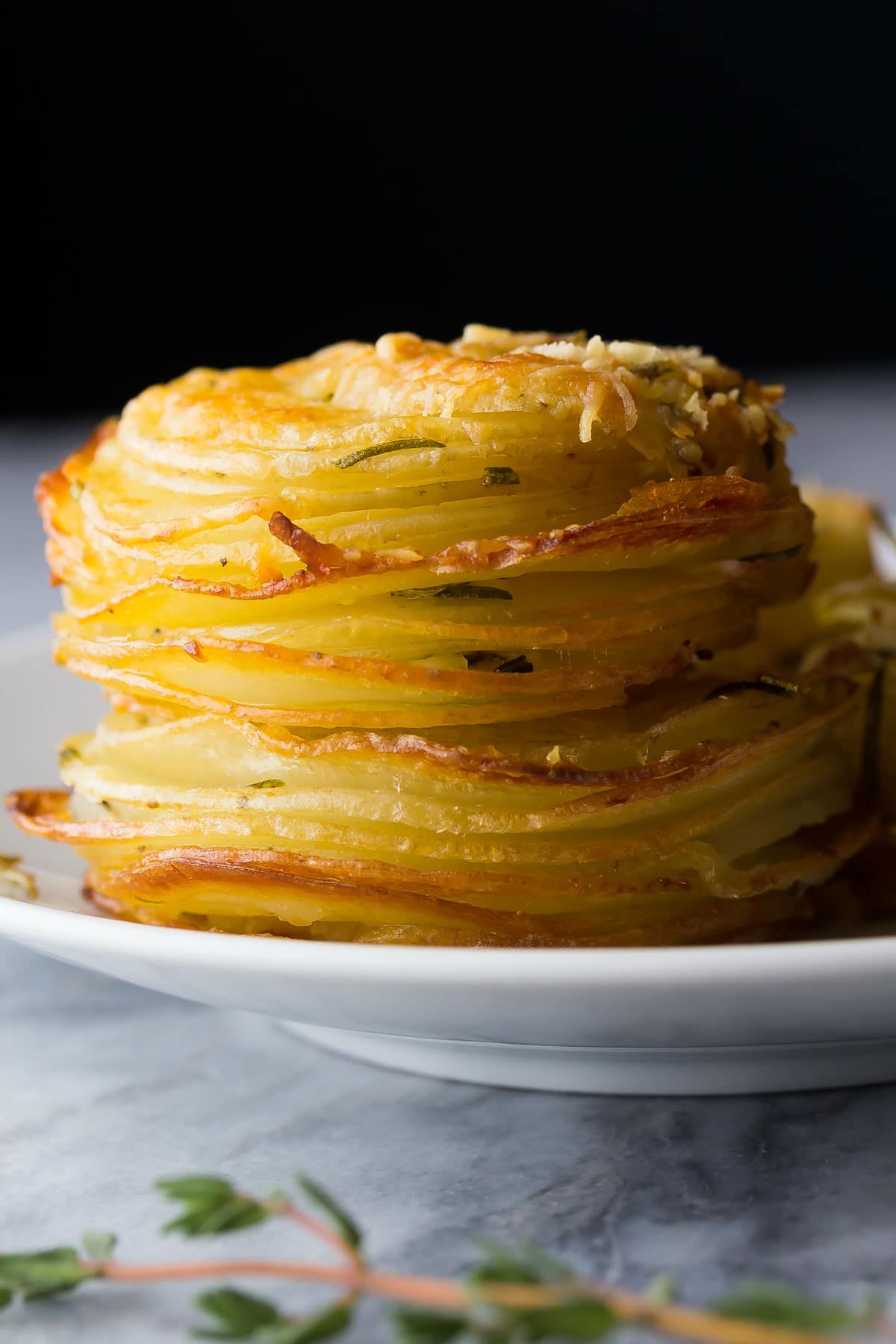 side view of herb and garlic potato stacks