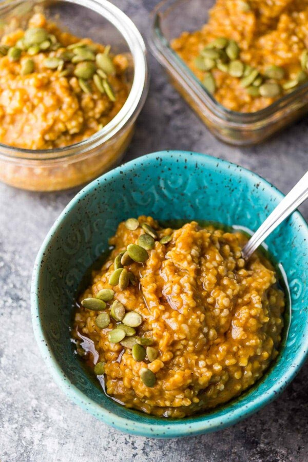 overhead shot of pumpkin steel cut oats in blue bowl with a spoon