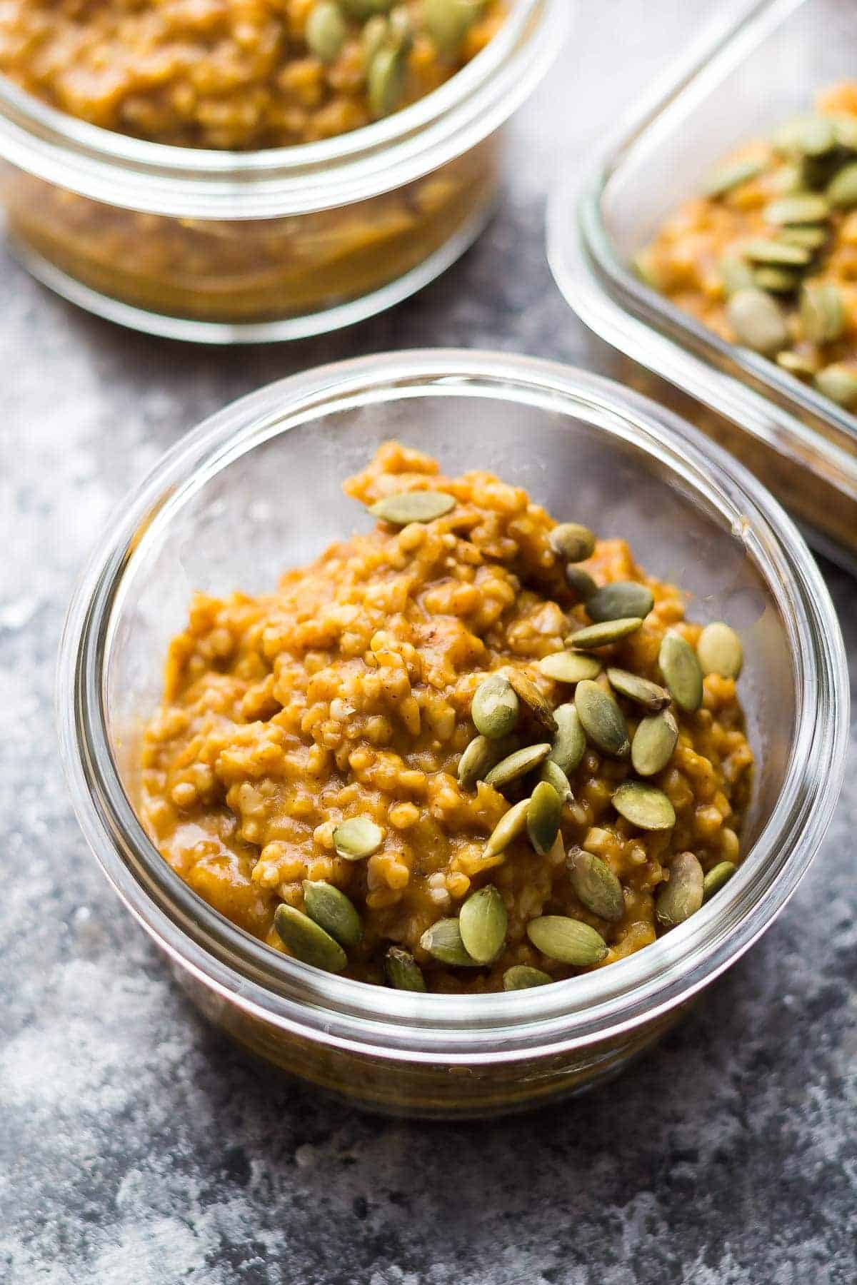 pumpkin steel cut oats portioned out into meal prep containers