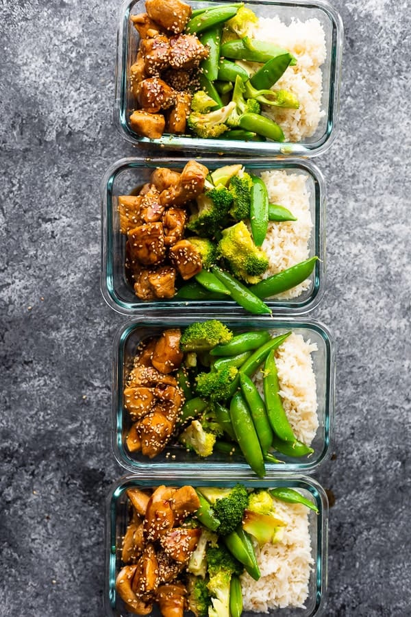 overhead shot of four Honey Sesame Chicken meal prep Bowls