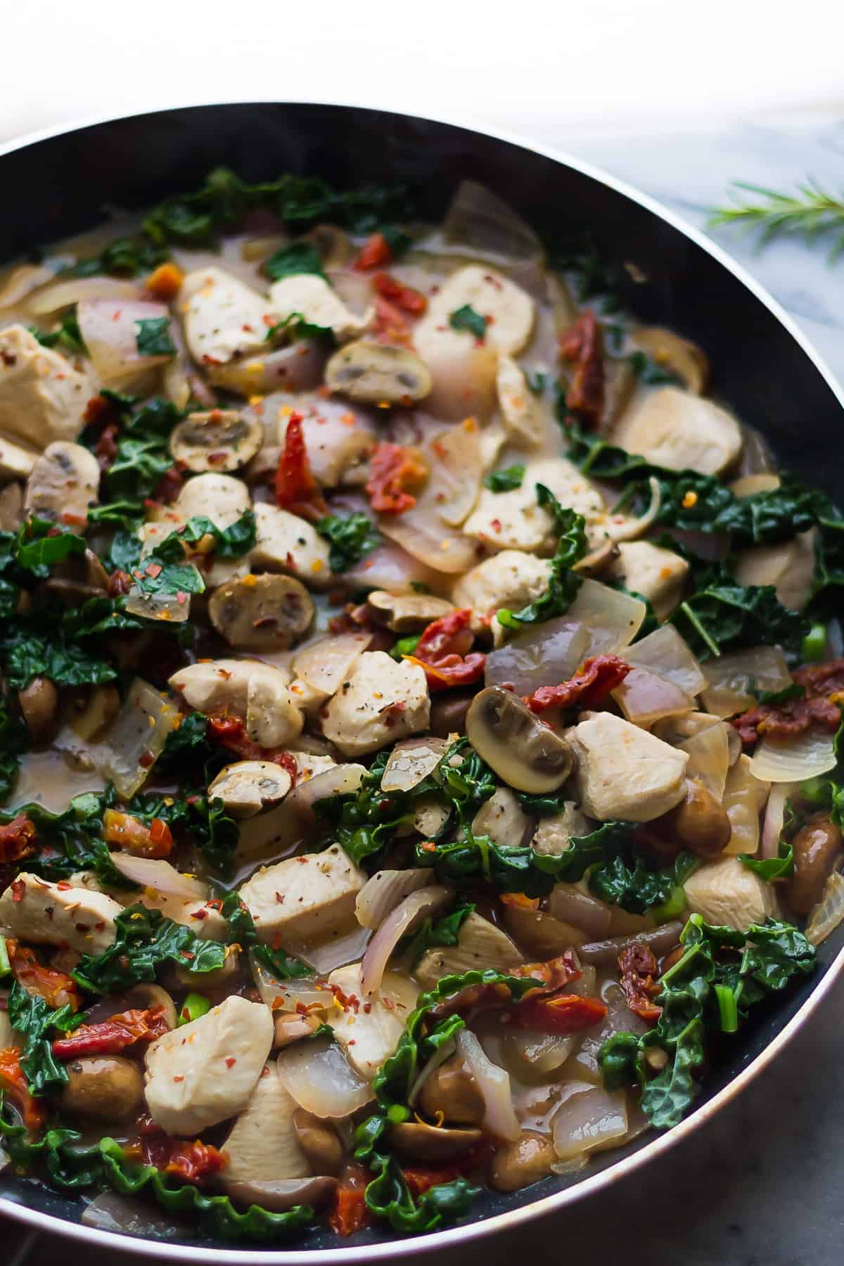 side angle view of tuscan chicken skillet