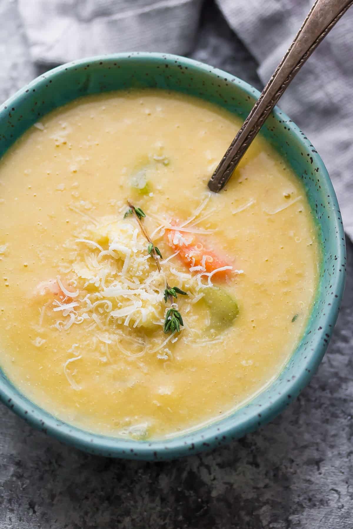 cauliflower quinoa chowder in blue bowl