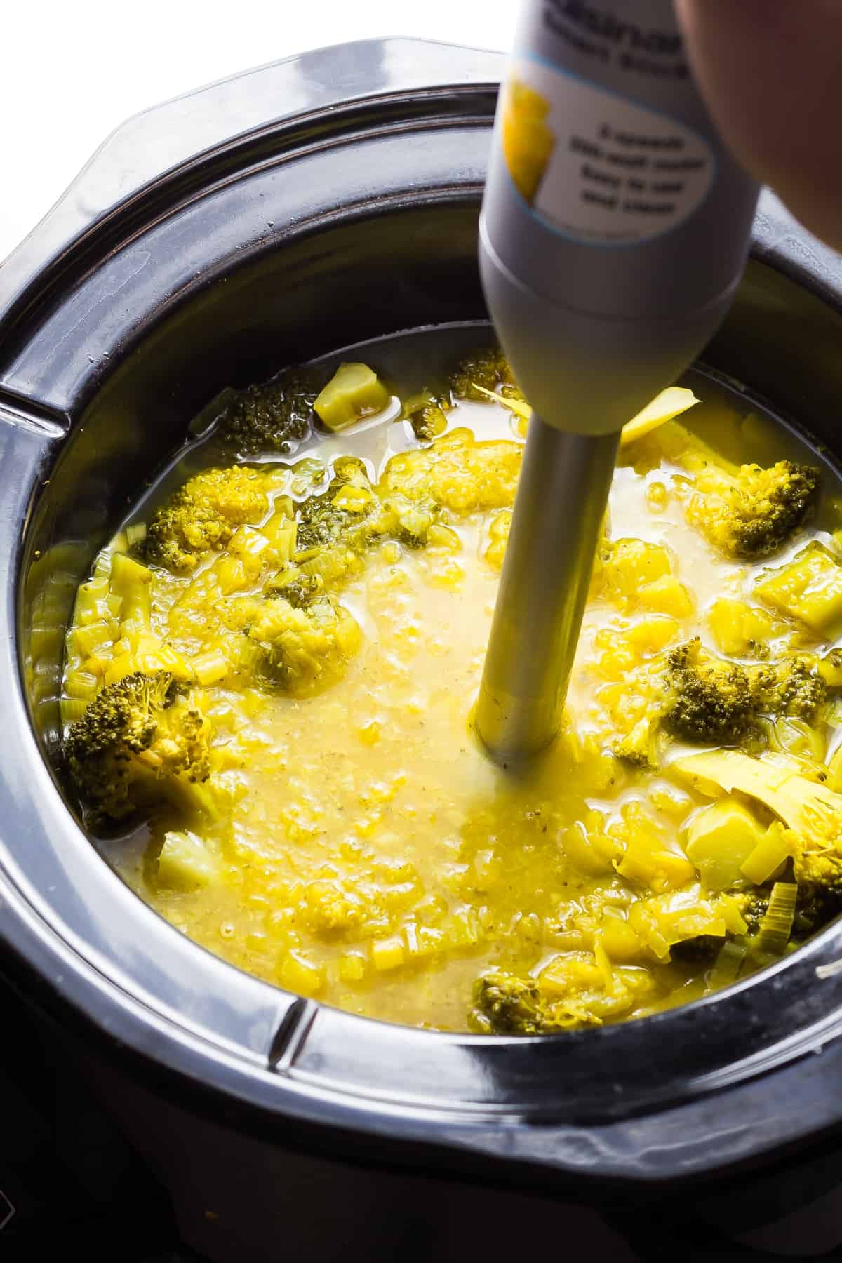 pureeing the broccoli turmeric soup after cooking