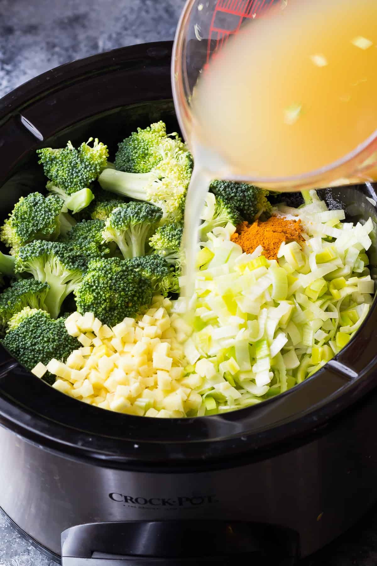 crockpot broccoli soup in slow cooker before cooking