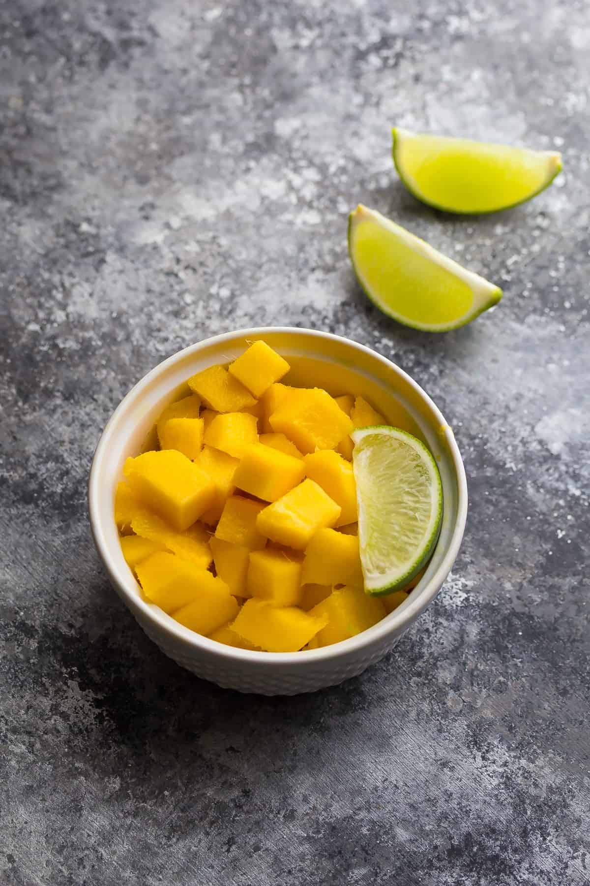 Jamaican Baked Chicken Dinner topped with fresh mango