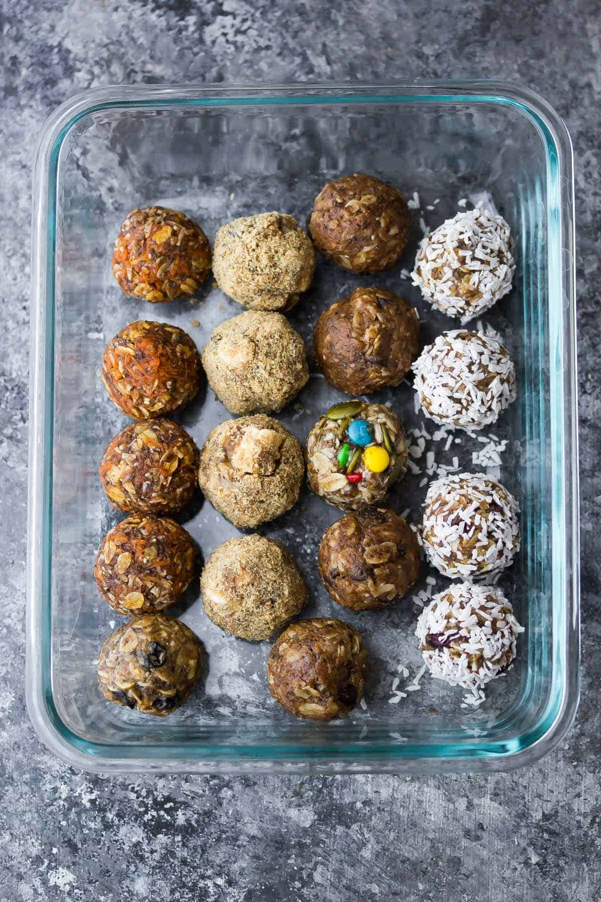 assortment of no bake energy bites in a meal prep container