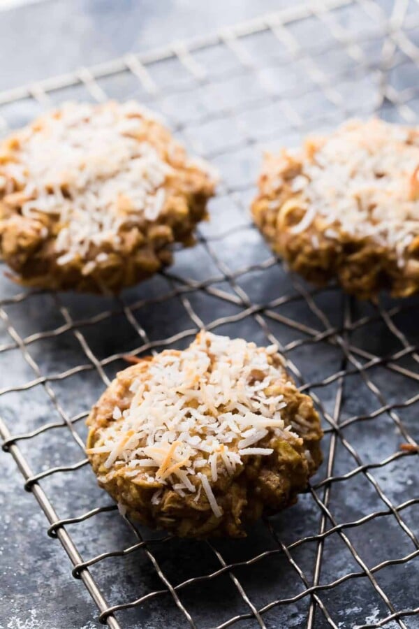 three healthy apple almond butter snack cookies cooling on wire rack