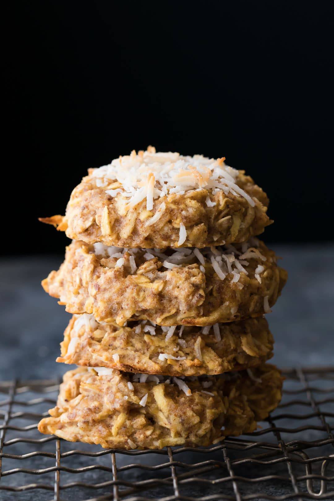 Stack of four Apple Almond Butter Snack Cookies on wire rack