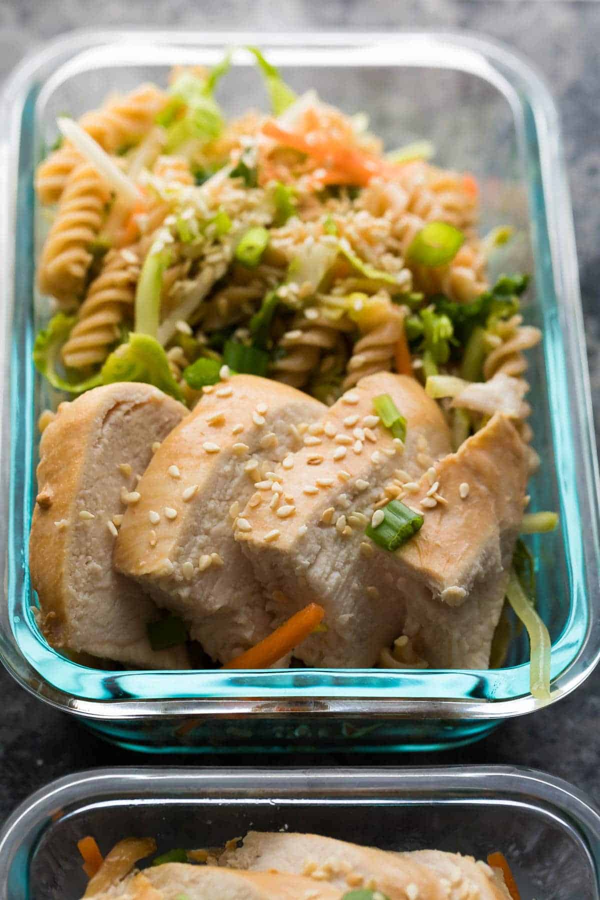 Sesame Chicken Pasta Salad in glass meal prep container