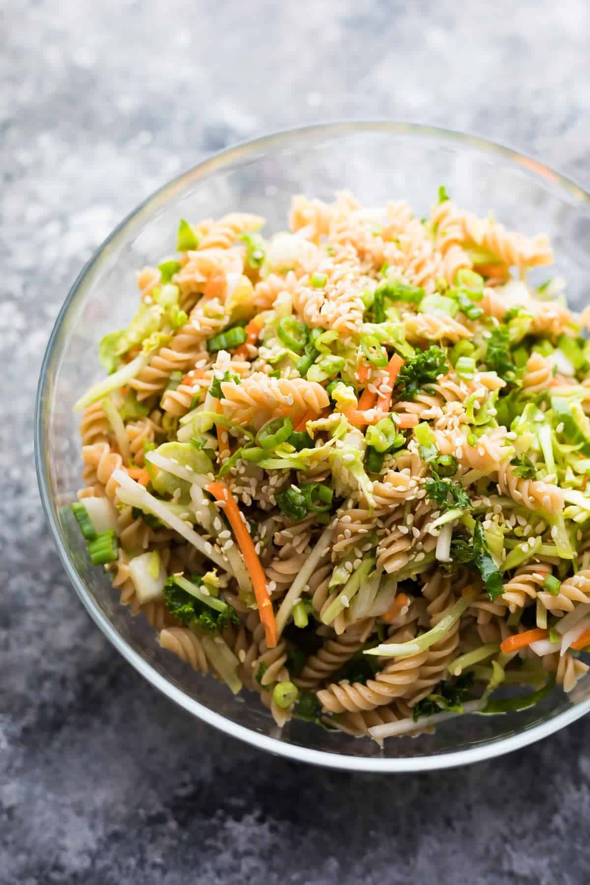 Mann's Power Blend mixed with pasta in large glass bowl