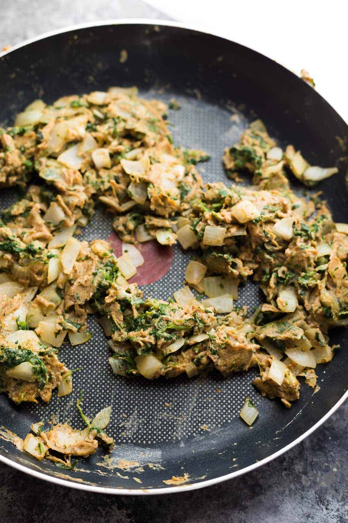 saute pan with the egg mixture filling for the Sweet Potato Breakfast Burritos