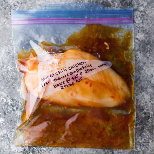 small plastic freezer bag with chicken and marinade