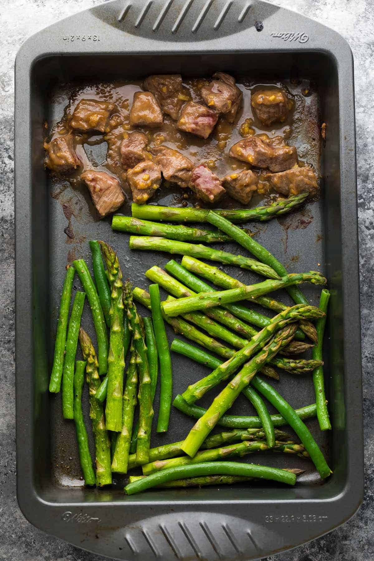 Hoisin Ginger Steak, green beans and asparagus in baking pan