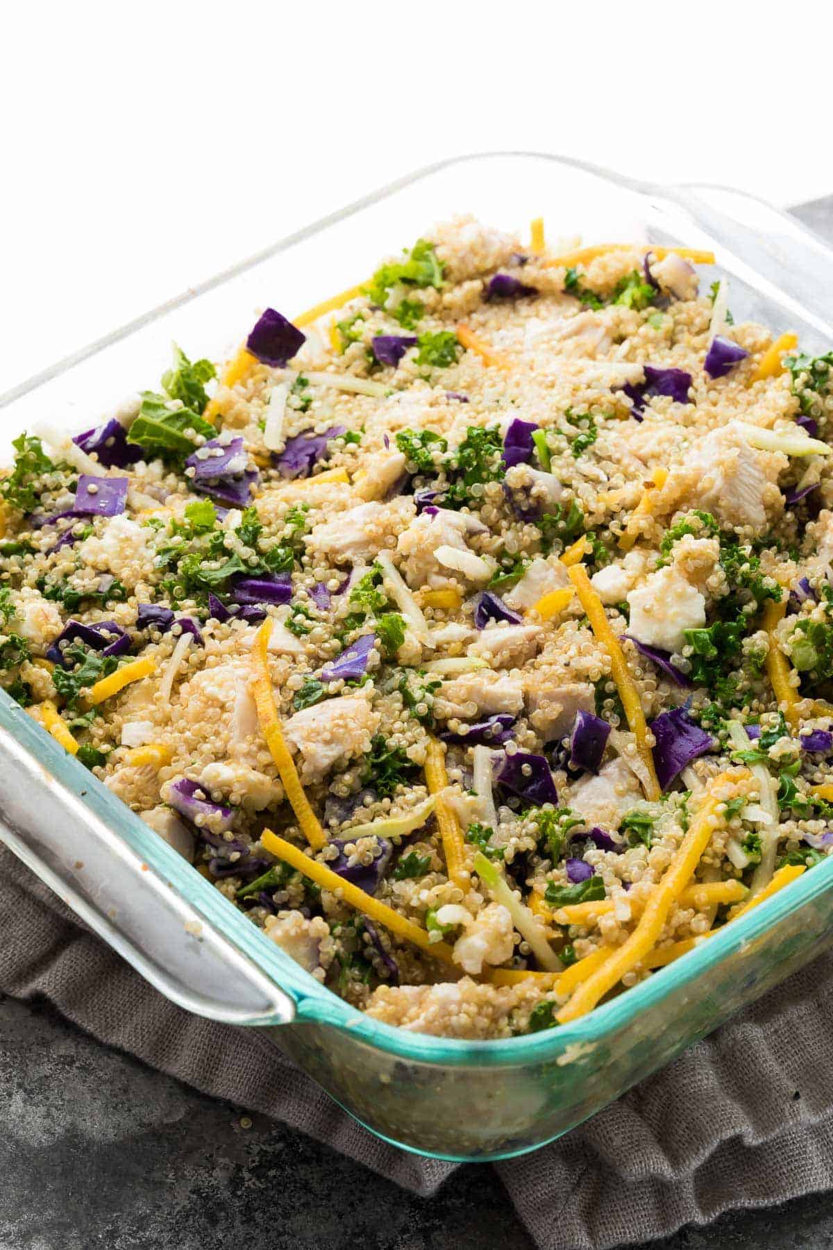 assembled Mediterranean Chicken Quinoa Casserole in baking dish before going into oven