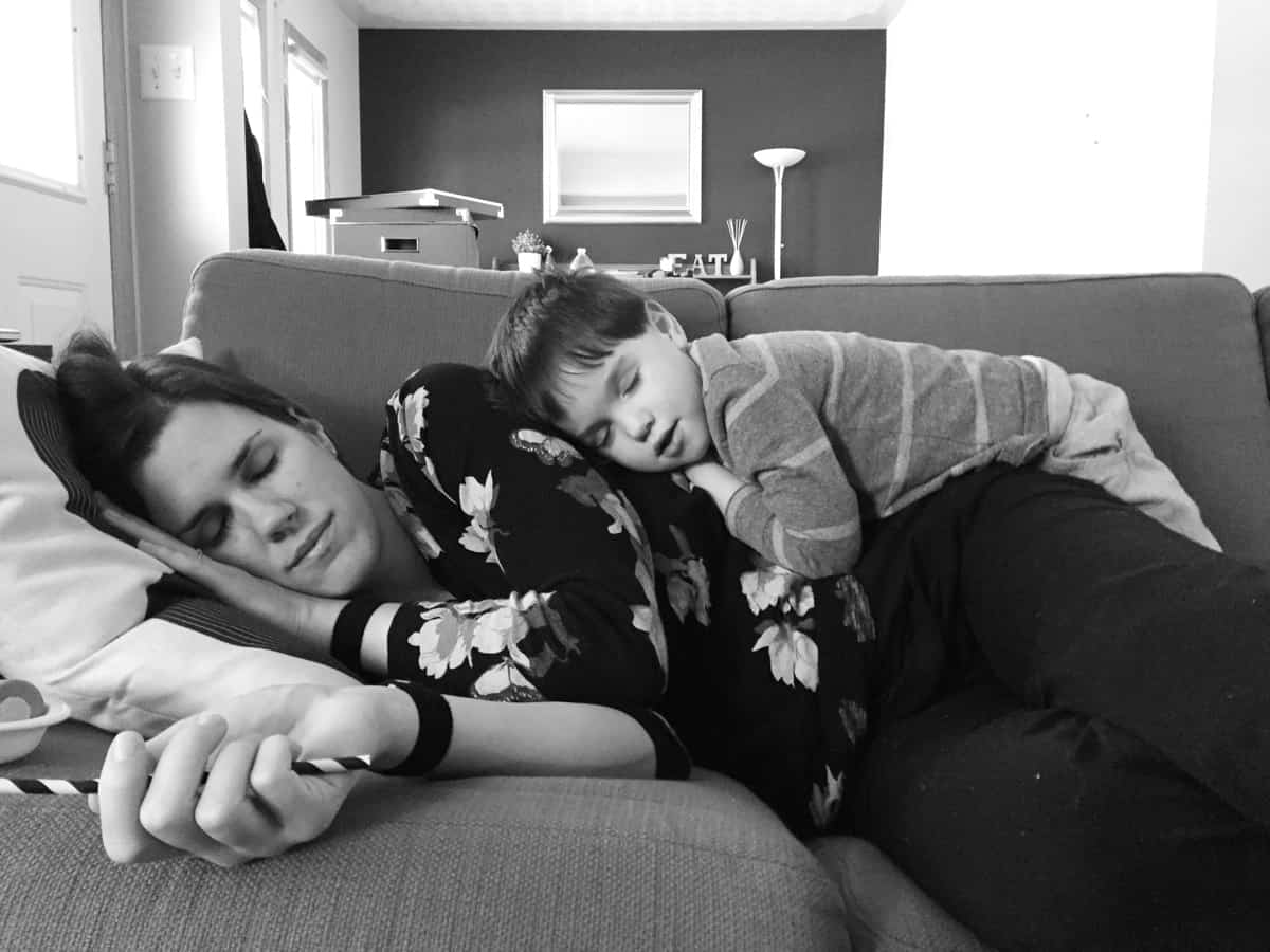 Denise lying on the couch with her son