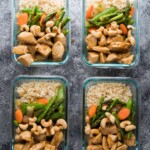 overhead shot of four maple ginger chicken meal prep bowls