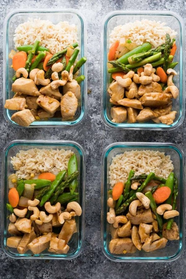overhead shot of four maple ginger chicken meal prep bowls