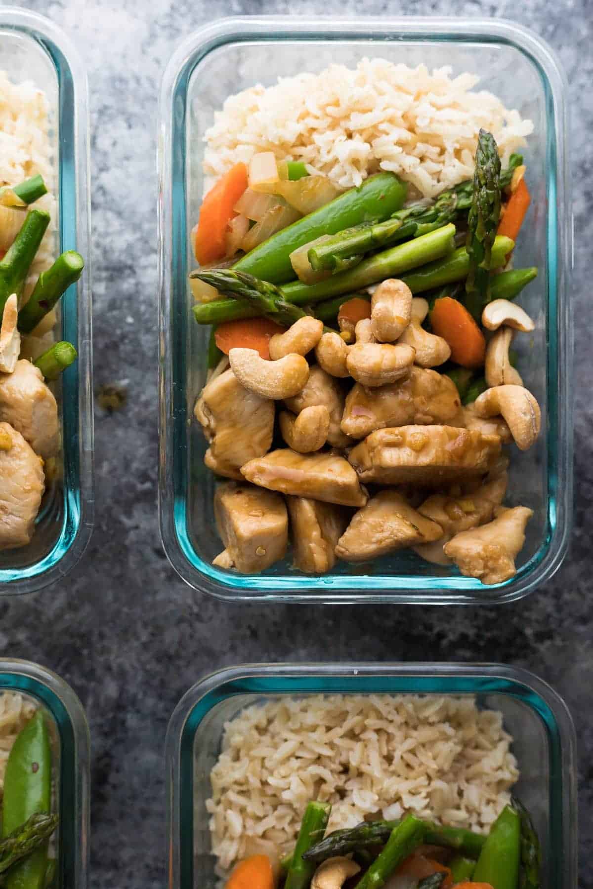 Overhead view of four Maple ginger chicken meal prep lunch bowls 