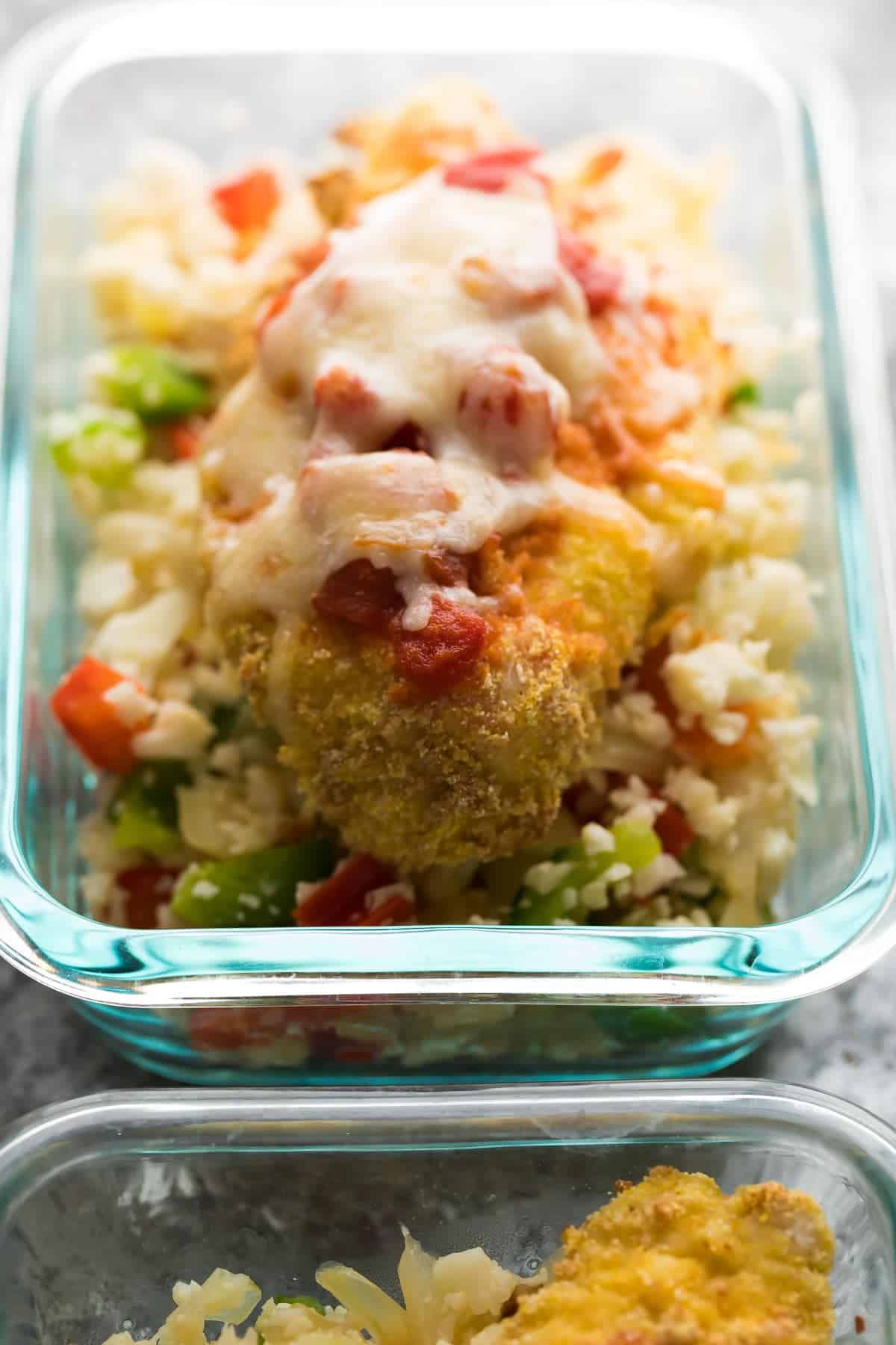 Mexican chicken parm and cauliflower rice meal prep bowls in glass containers
