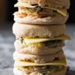 stack of three mushroom bacon swiss breakfast sandwiches