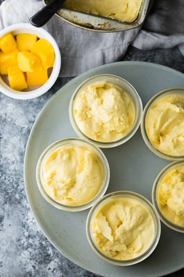 five jars of mango cheesecake frozen yogurt on serving plate