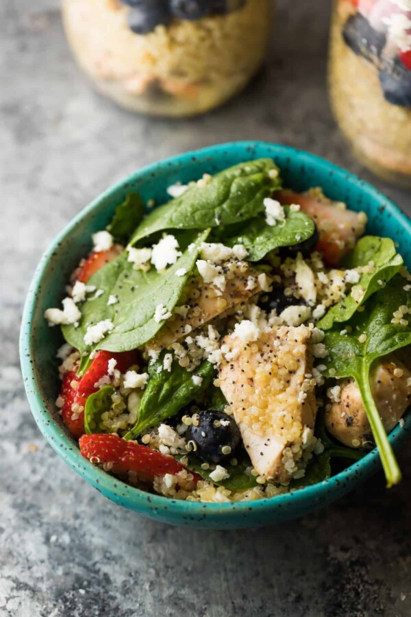 Strawberry Spinach Quinoa Salad served in a blue bowl