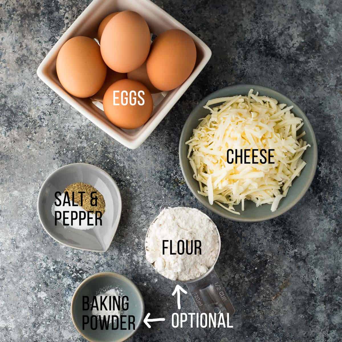 overhead shot of ingredients for egg muffins in separate bowls with labels