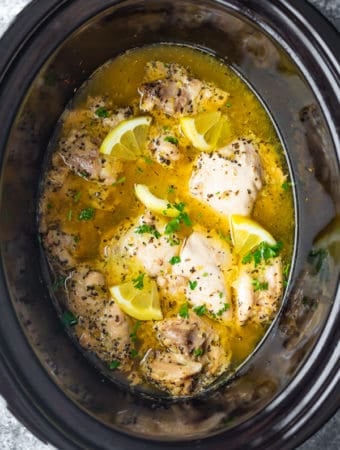 overhead shot of lemon garlic chicken thighs in slow cooker