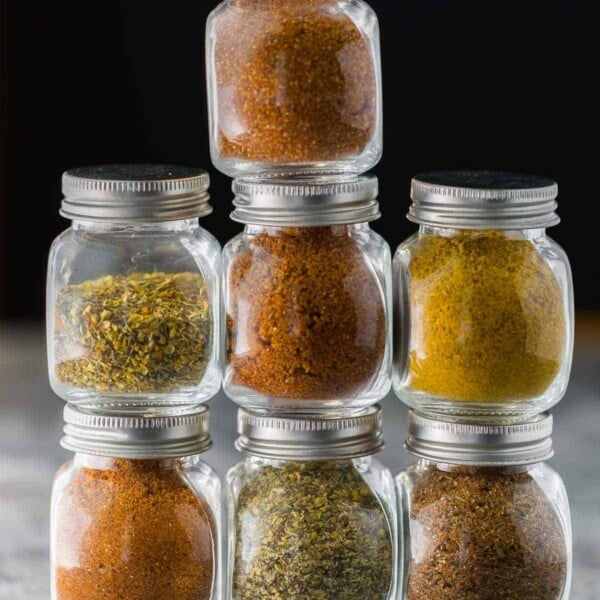 stack of jars filled with seven different dry rub  recipes