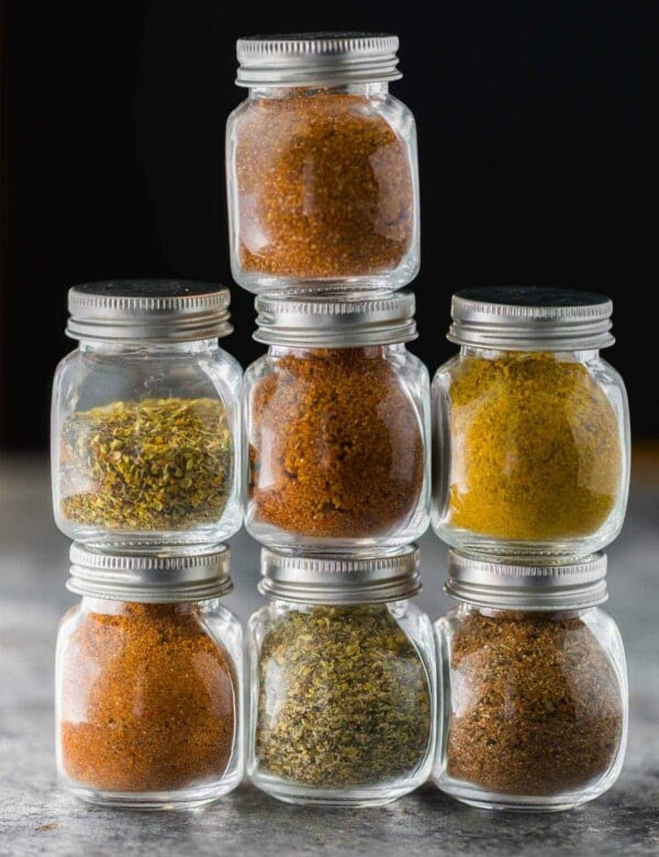 stack of jars filled with seven different dry rub recipes