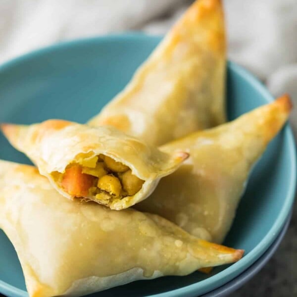 baked cauliflower chickpea samosas in a small blue bowl