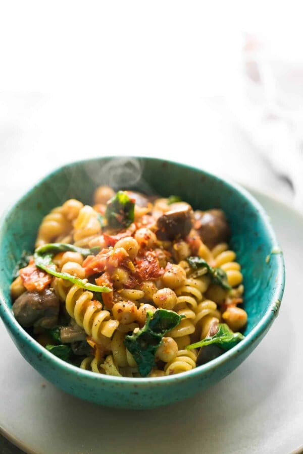 Sun dried tomato pasta in a blue bowl