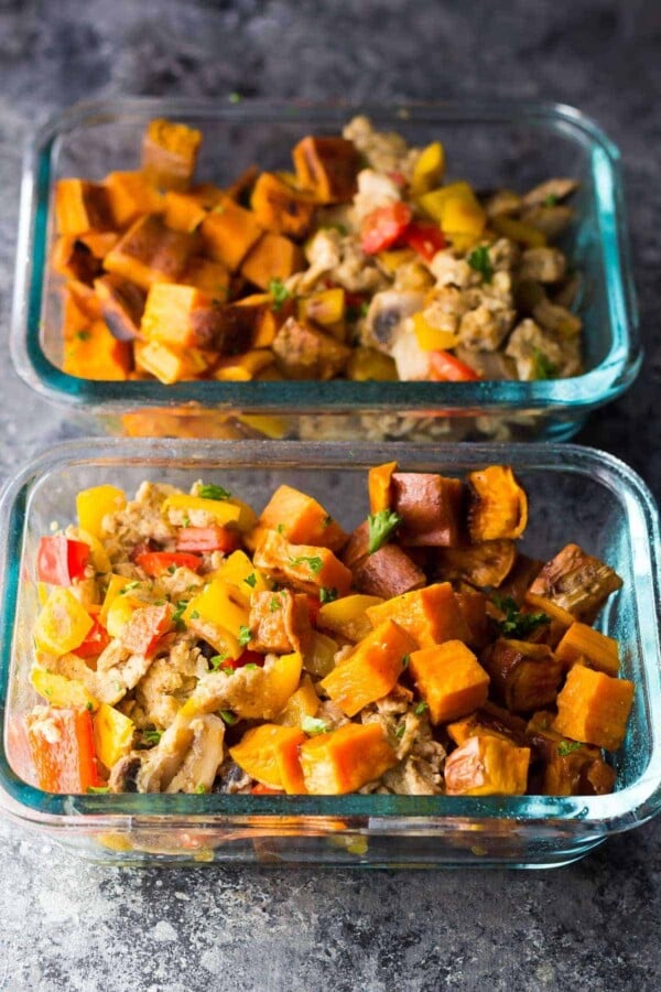two glass containers filled with sweet potato breakfast bowls