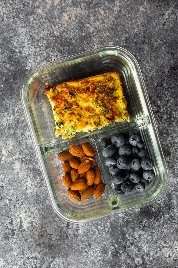 overhead view of herb & zucchini egg bake recipe in meal prep container