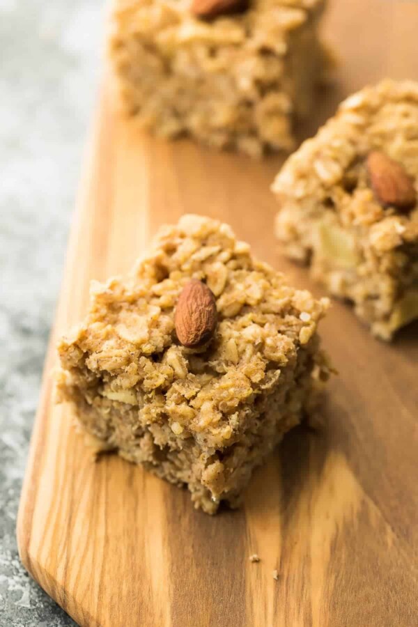 three apple quinoa breakfast bars on wood cutting board