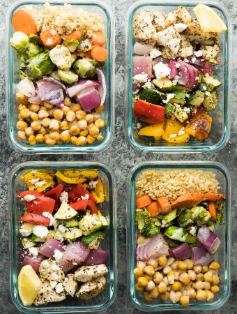 overhead shot four glass meal containers with chickpea buddha bowls and greek chicken wraps