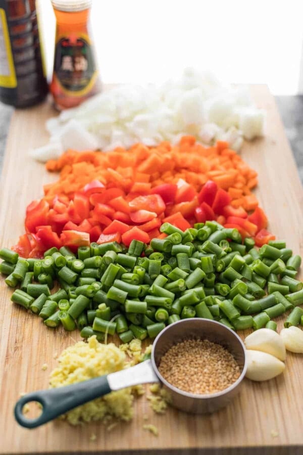 ingredients for fried rice on cutting board