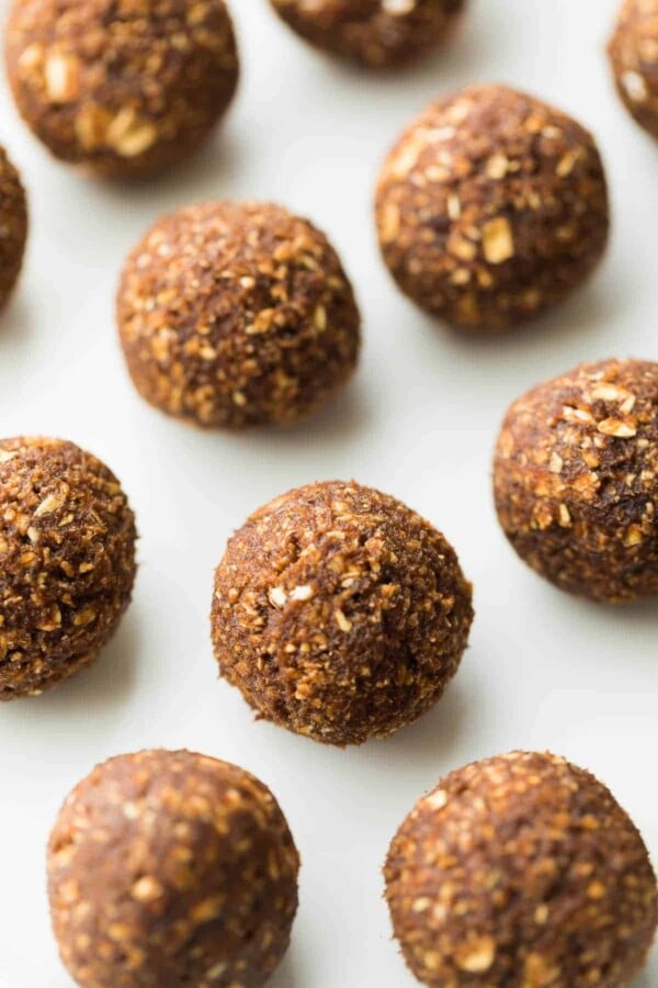 nut free energy bites in rows on parchment paper