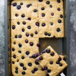 overhead shot of sheet pan protein pancakes cut in large squares