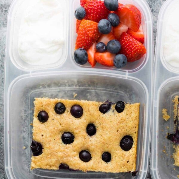 plastic container with sheet pan protein pancake fruit and yogurt