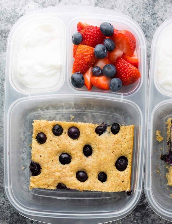 plastic container with sheet pan protein pancake fruit and yogurt