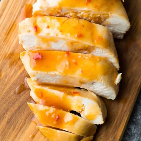 sliced sweet chili chicken on wood cutting board