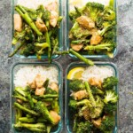 overhead shot of four glass meal prep containers with vegetable and rice stir fry
